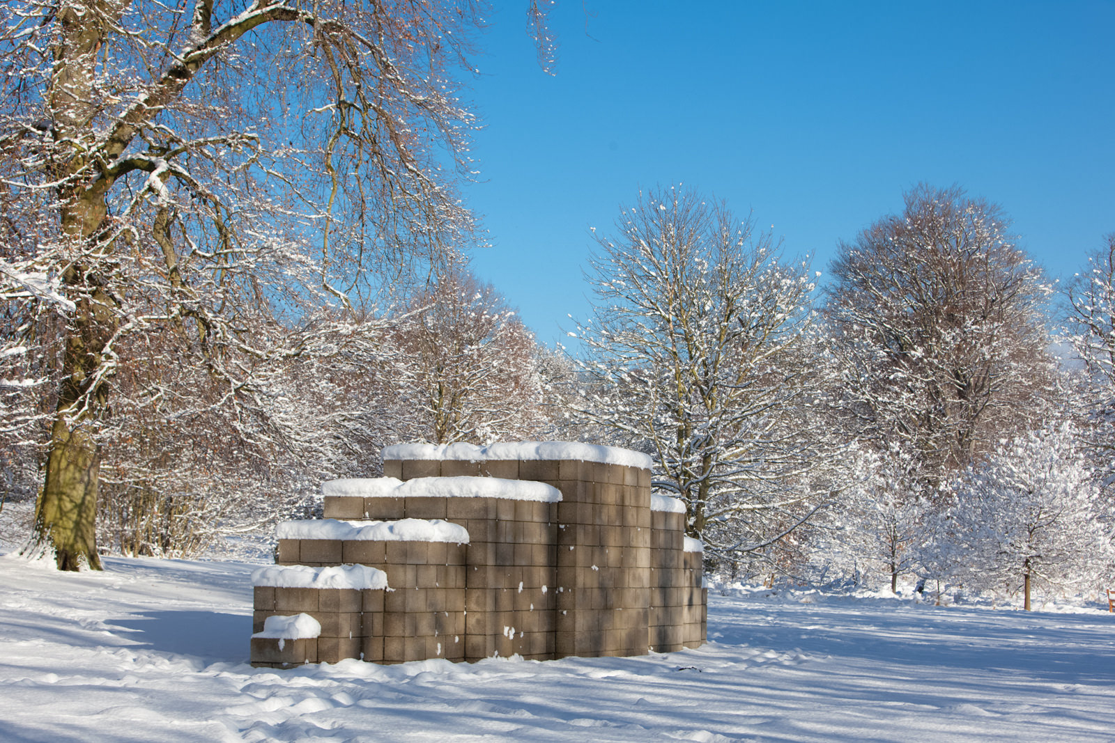 Sculpture in the parkland in a snowy day.