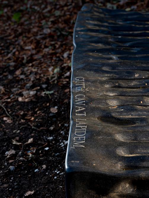 Detail of Willem Boshoff – Flagstone 2016 which reads "Gutta cavat Lapidem,"at Yorkshire Sculpture Park