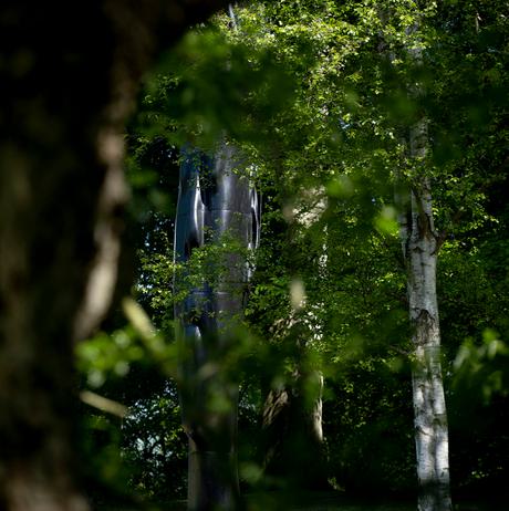 Jaume Plensa, Wilsis seen through the trees at Yorkshire Sculpture Park