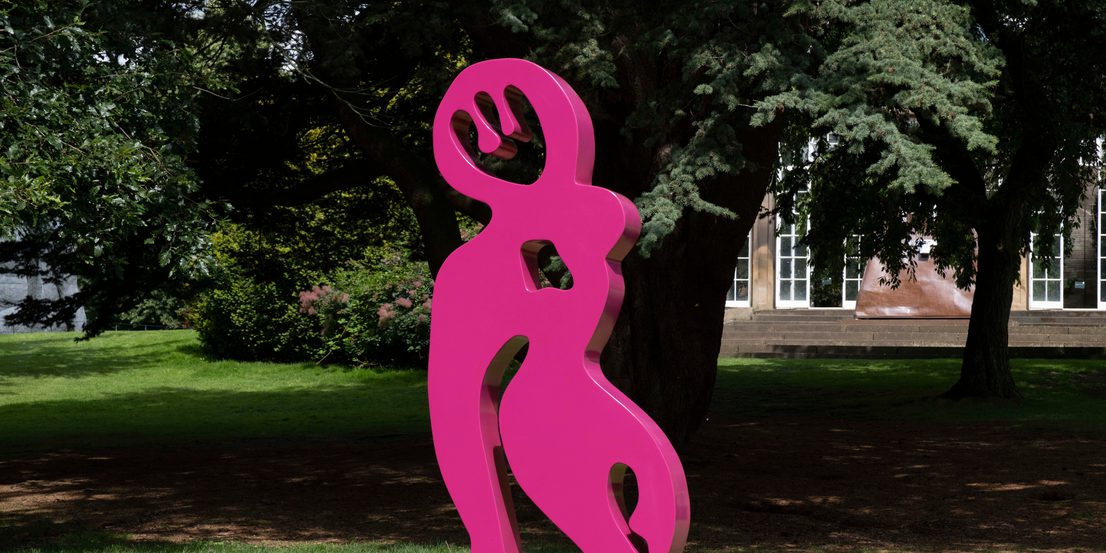 A bright pink abstract sculpture