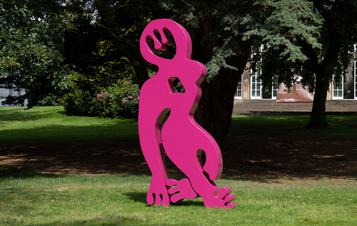 A bright pink abstract sculpture