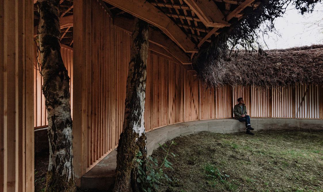 Visitor sat inside Heather Peak and Ivan Morison – Silence Alone in a World of Wounds, 2021 at Yorkshire Sculpture Park