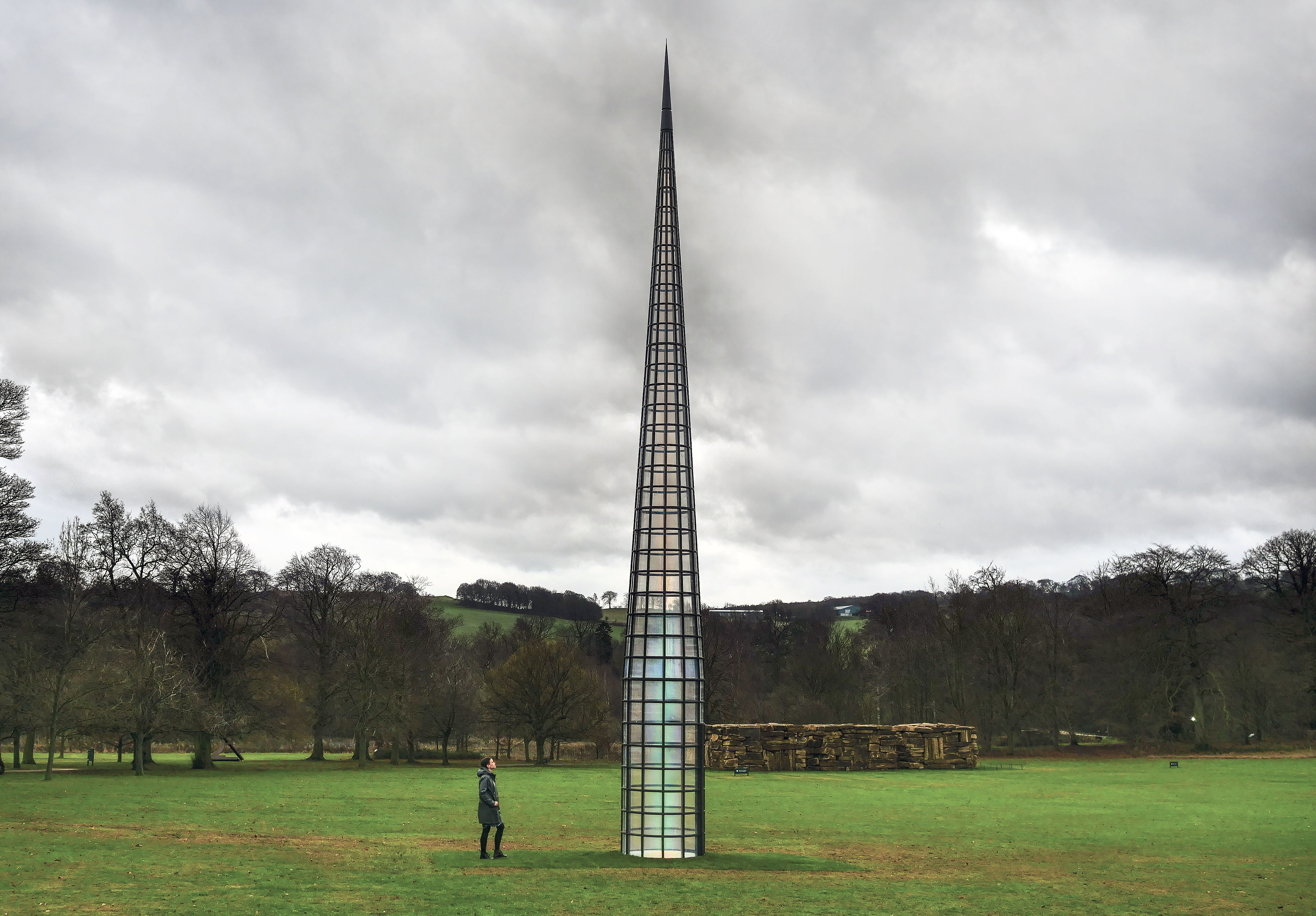 A visitor looking up at Kimsooja – A Needle Woman 2014 at Yorkshire Sculpture Park