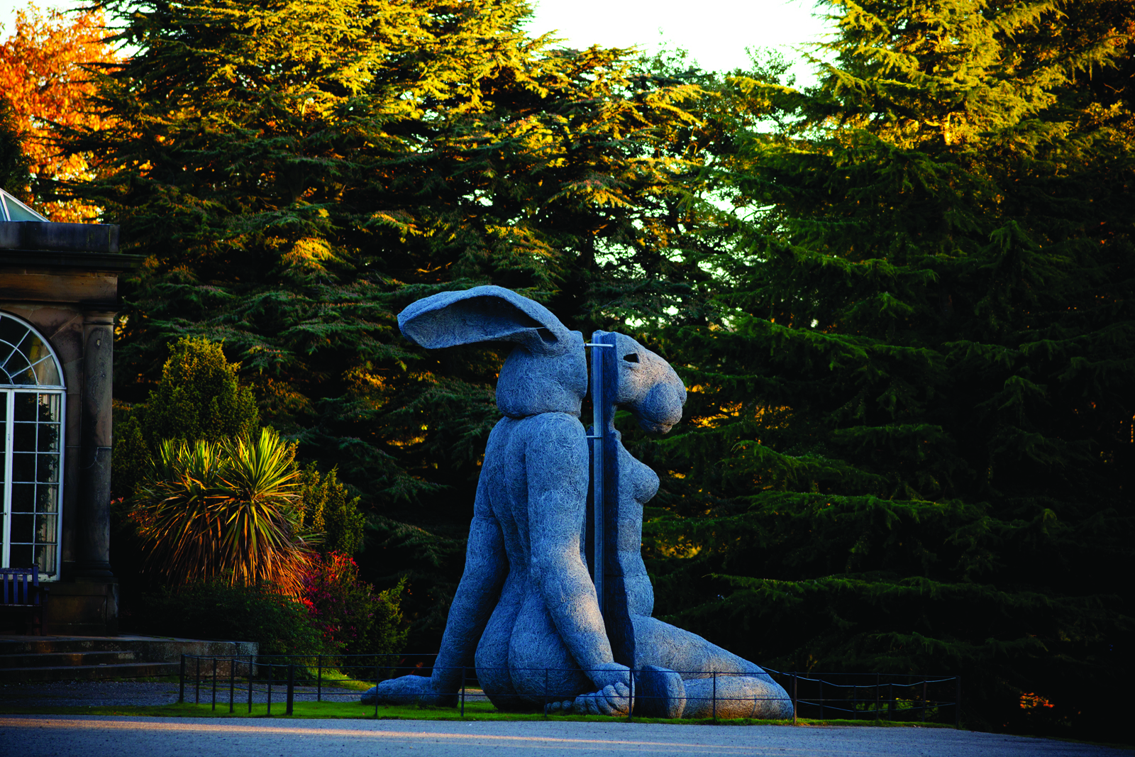 A sculpture with a woman's body and a rabbit head