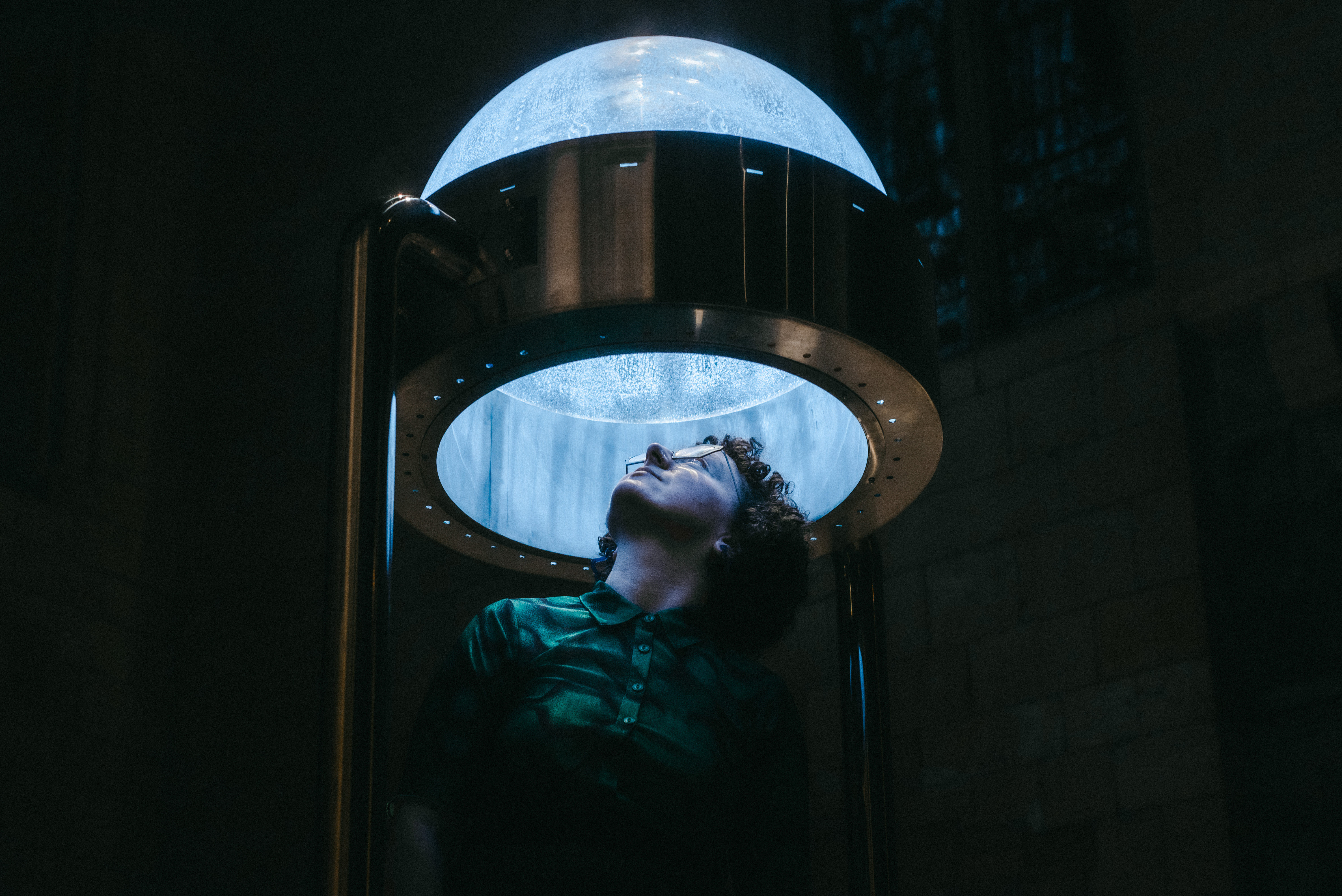 a person looking up into a bubble-like structure