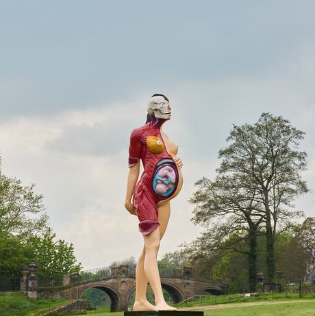 Anatomical sculpture of a pregnant woman and fetus in the parkland at YSP.