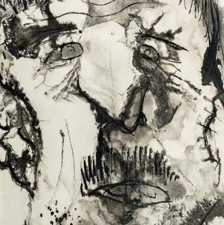 A child's pencil drawing of a face