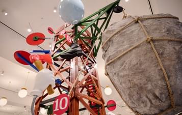 A colourful scaffolding structure with giant targets, models of hands, targets and rocks