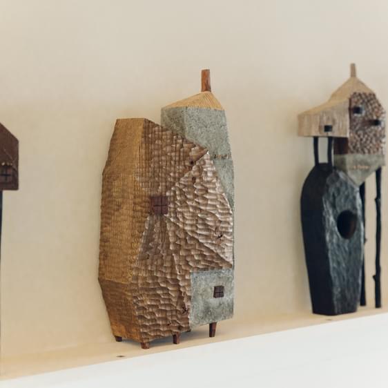 A display of carved wooden houses