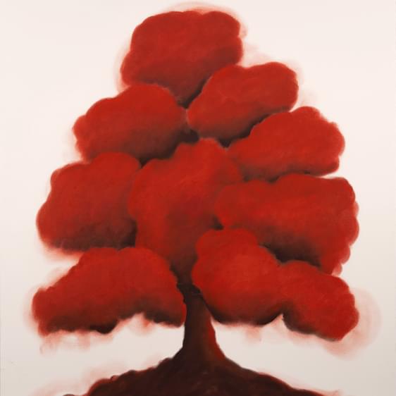 Pastel drawing of a red bushy tree on paper.