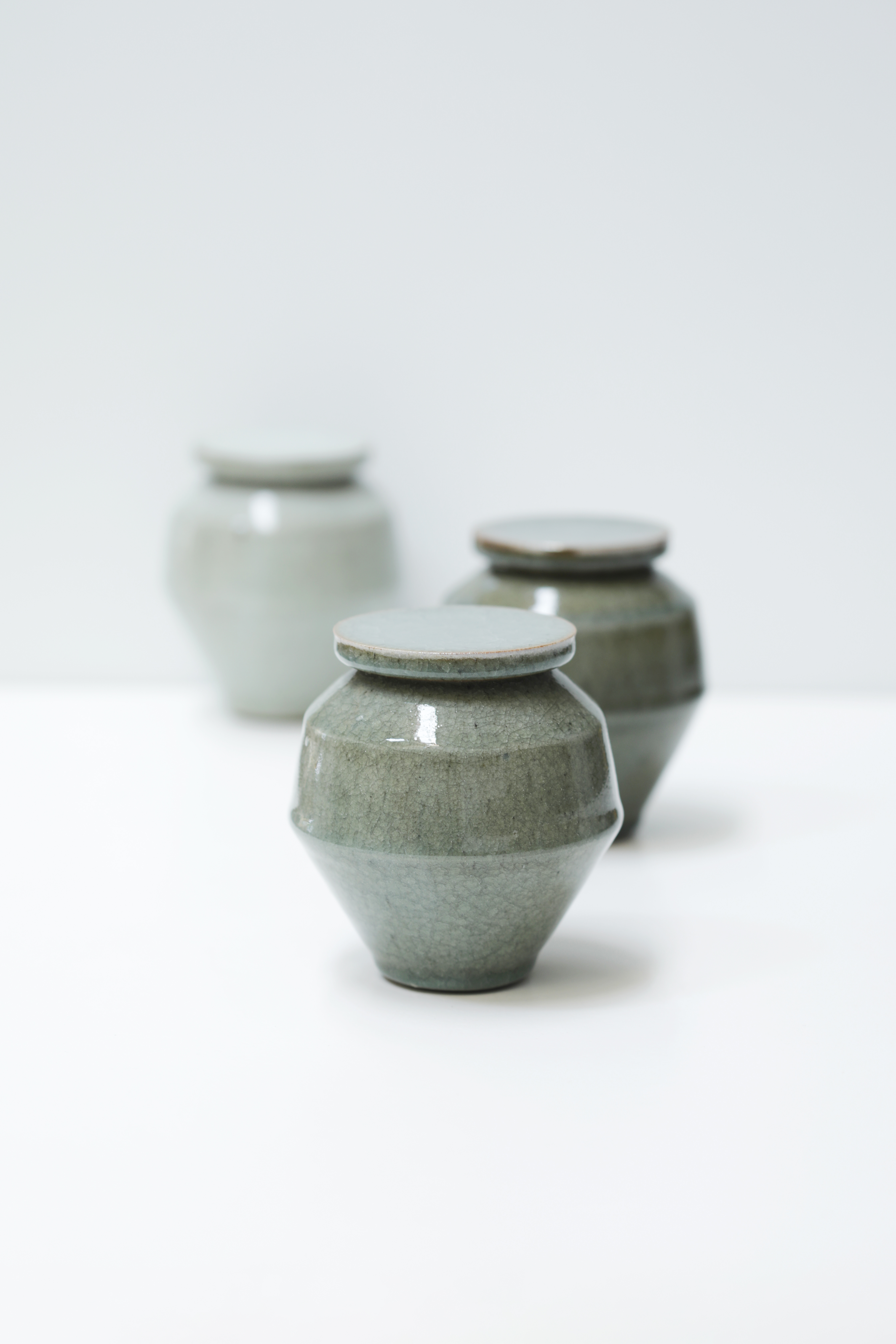 Three angular ceramic jars