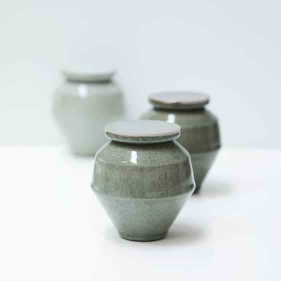 Three angular ceramic jars