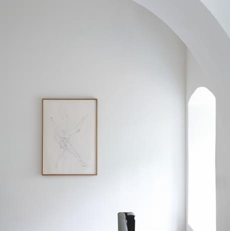 Framed pencil drawing of legs, hung on the wall of the Chapel at YSP.