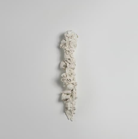 Porcelain sculpture hung on a wall of the Chapel at YSP.