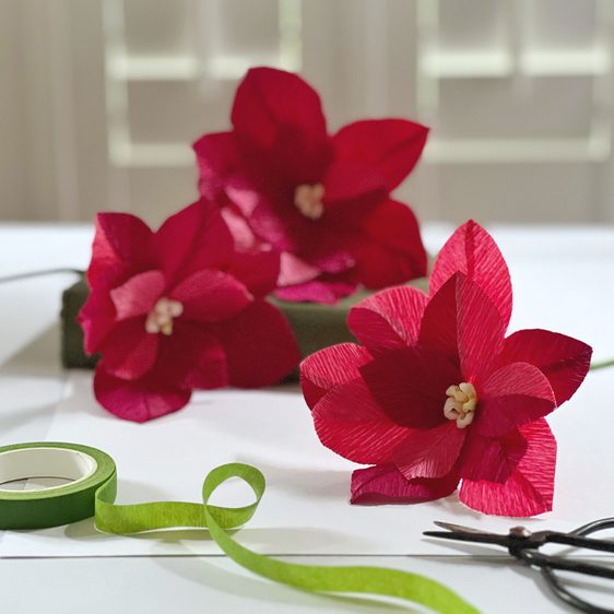 Three red paper flowers