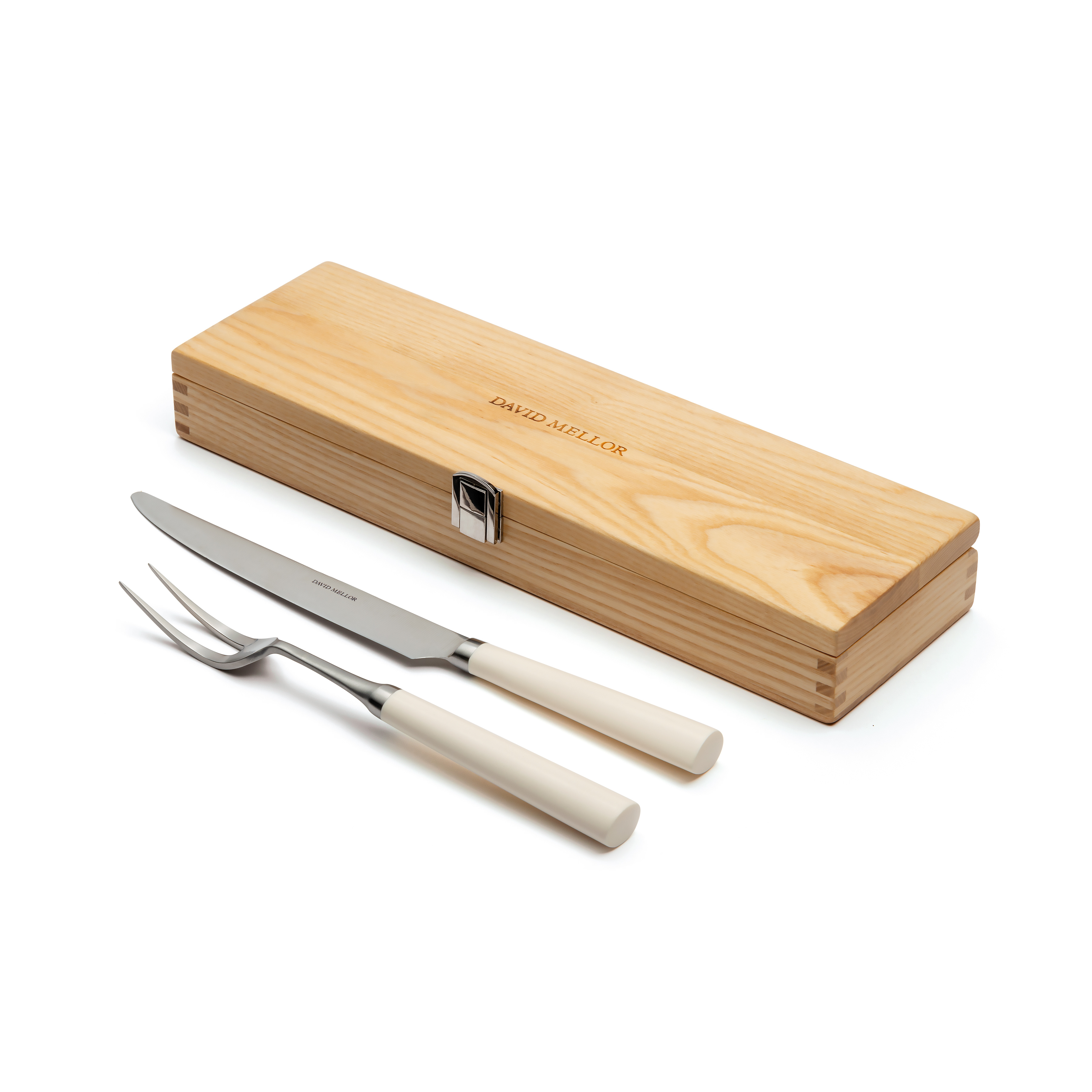A wooden box and a carving knife and fork