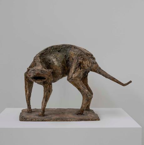 A plaster sculpture of a cat