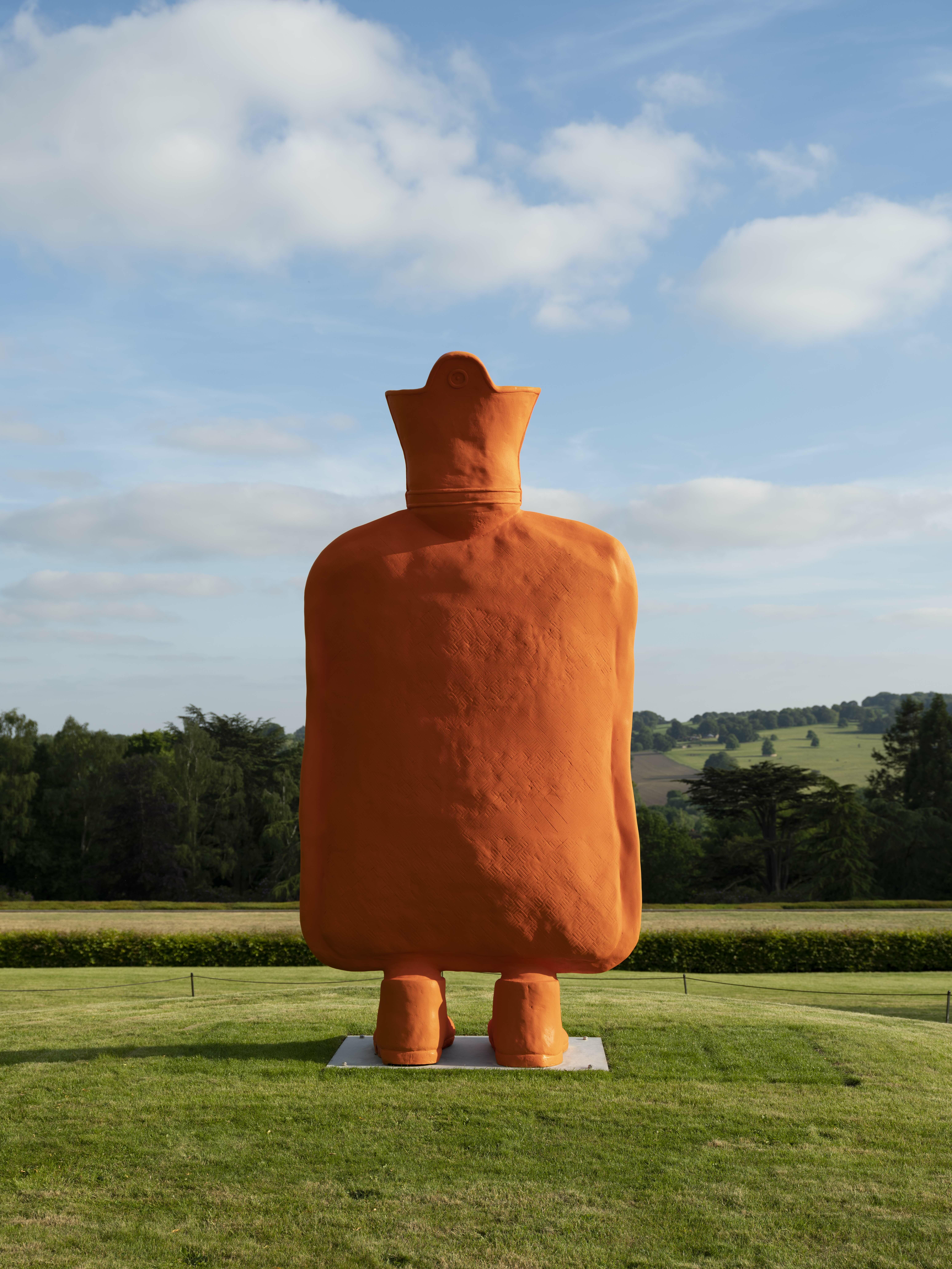 A giant orange hot water bottle with legs.