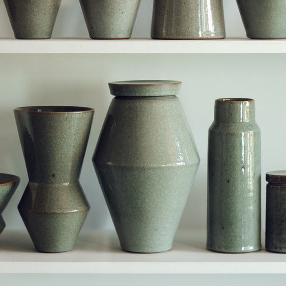 A selection of ceramic vessels on a shelf