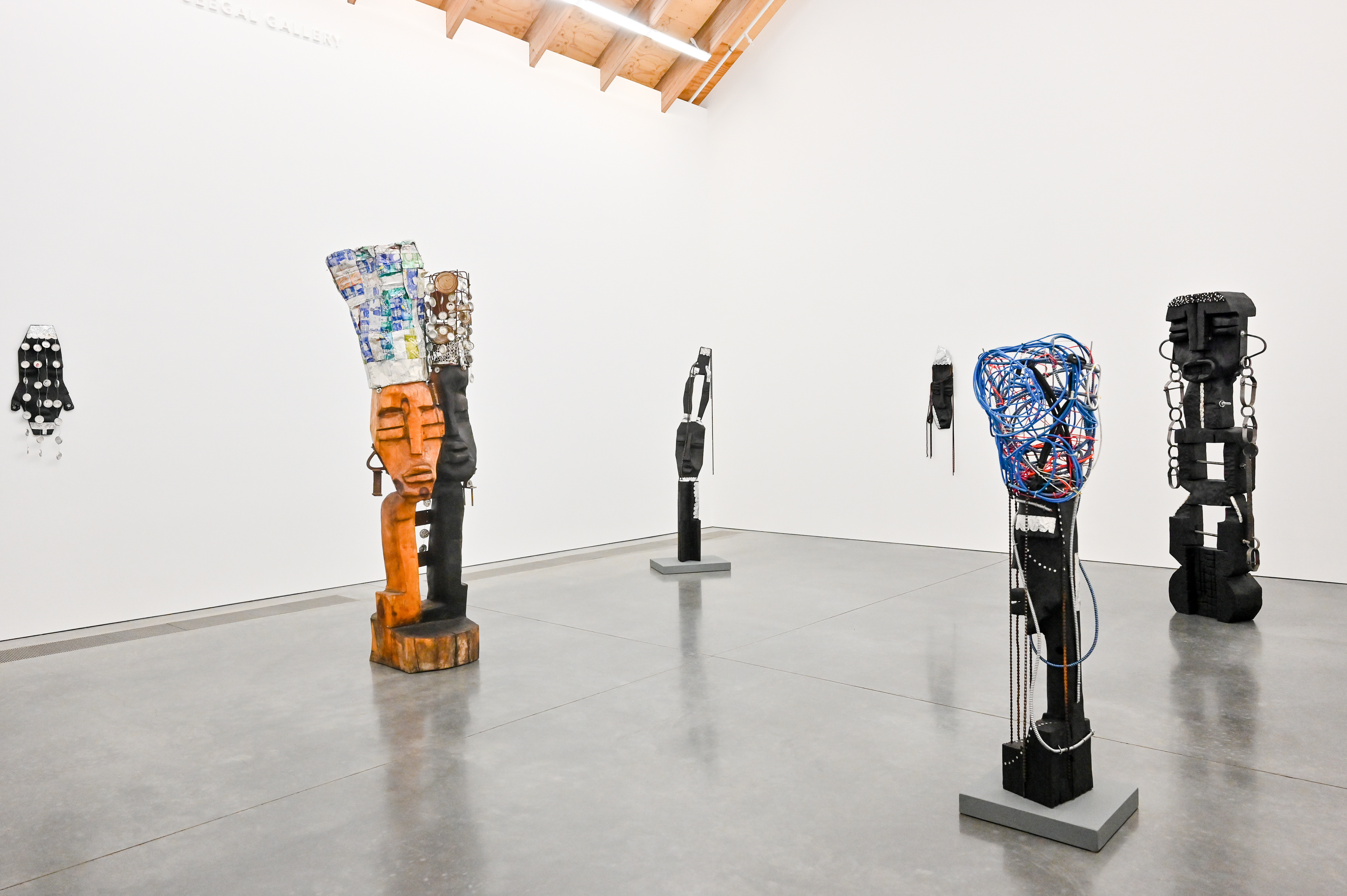 Multiple abstract sculptures in a gallery