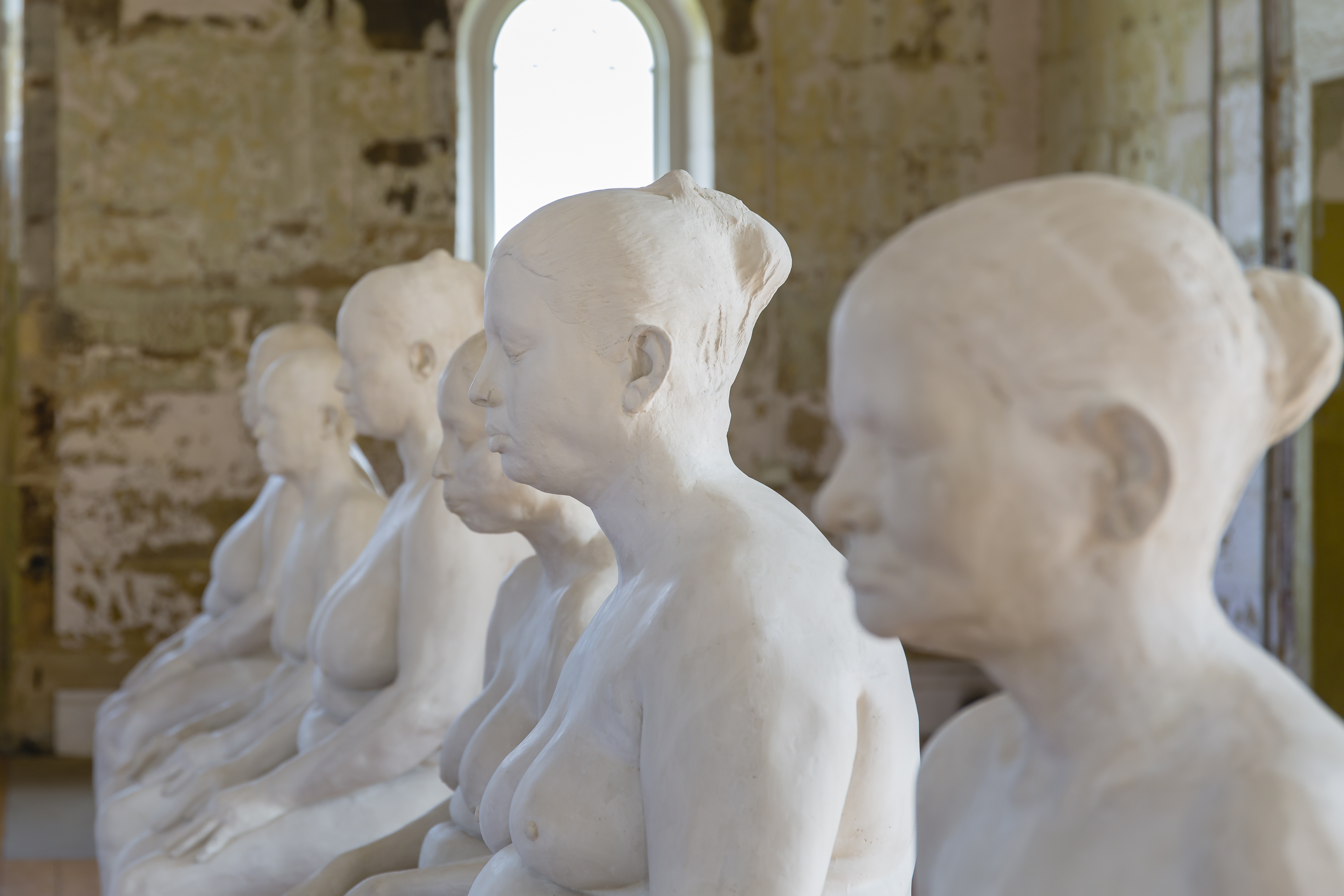 Plaster casts of six nude female figures.