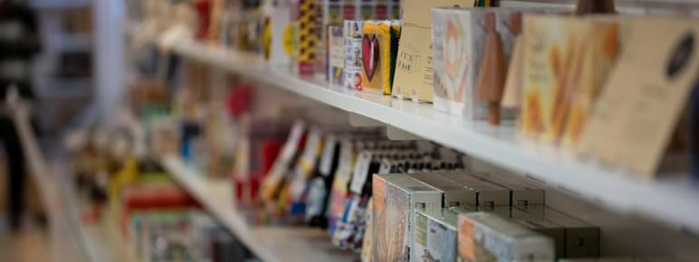 Rows of shelving filled with colourfully packaged products.