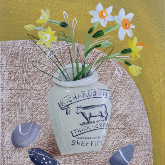 A painting of a bunch of Narcissus flowers in a stoneware vase, displayed on a table with stones.