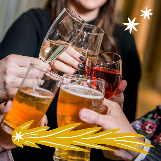 A group of people clinking glasses of alcohol