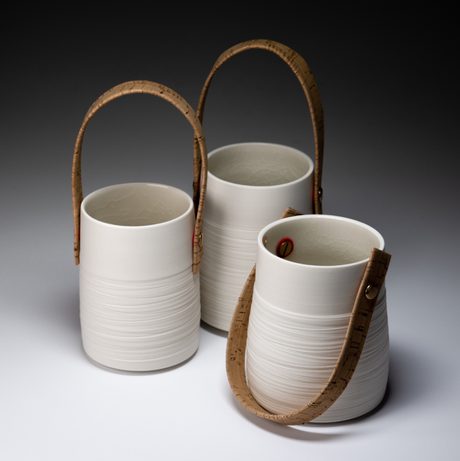 Three ceramic vessels with leather handles
