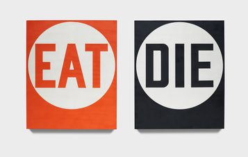 Two painted panels, one red with the word EAT in a white circle, the other black with DIE in a white circle.