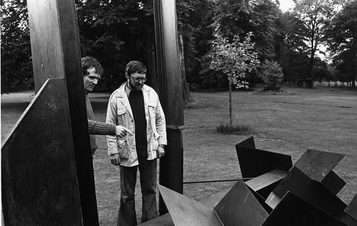 Two men looking at a sculpture, Founder of YSP Peter Murray CBE with artist Michael Lyons.