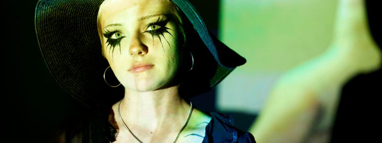 A person with dramatic black eye makeup