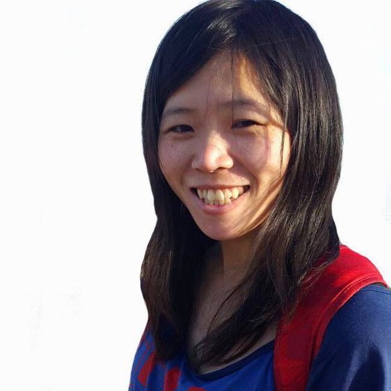 A smiling woman with long black hair.