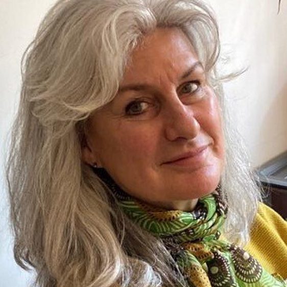 A woman with long white blonde hair.