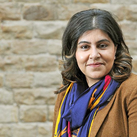 A woman with shoulder length brown hair.