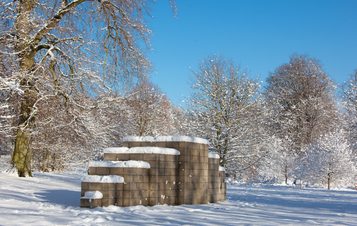 Sculpture in the parkland in a snowy day.
