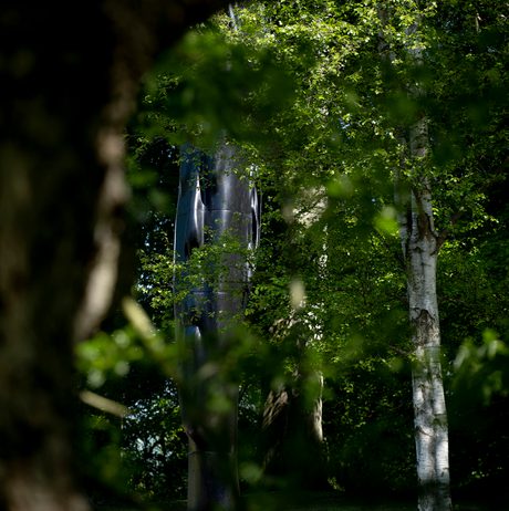 Jaume Plensa, Wilsis seen through the trees at Yorkshire Sculpture Park
