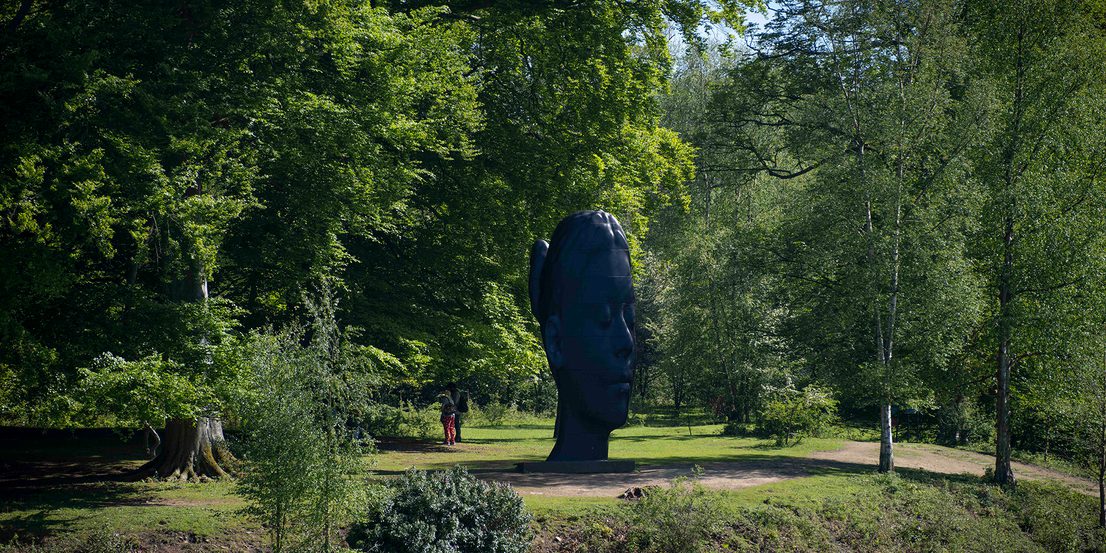 Jaume Plensa, Wilsis seen from across a lake at Yorkshire Sculpture Park