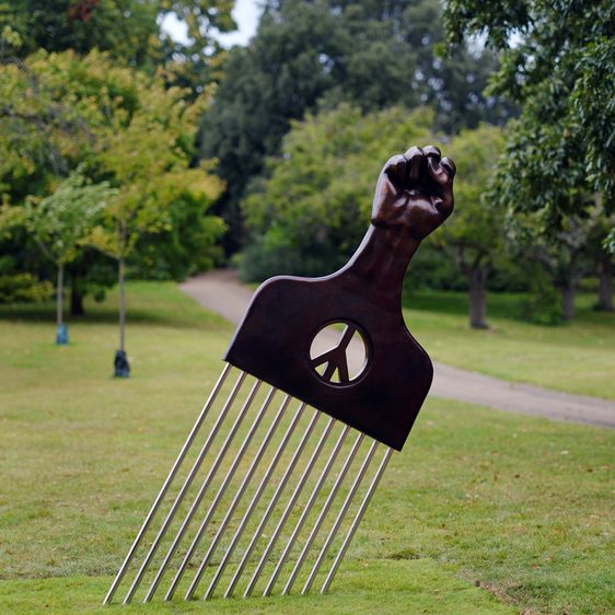 A giant Afro comb displayed outdoors