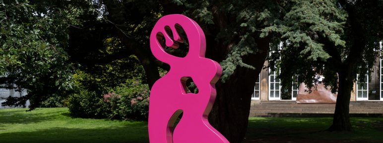 A bright pink abstract sculpture
