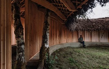 Visitor sat inside Heather Peak and Ivan Morison – Silence Alone in a World of Wounds, 2021 at Yorkshire Sculpture Park