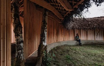 Visitor sat inside Heather Peak and Ivan Morison – Silence Alone in a World of Wounds, 2021 at Yorkshire Sculpture Park