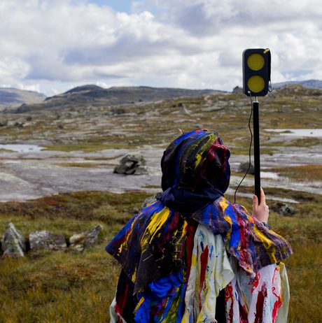 Someone holding a hand held microphone in the process of making Dillan Marsh and Eleanor Clare Woods - The Poacher’s Lament and Other Half Heard Tales 2019.