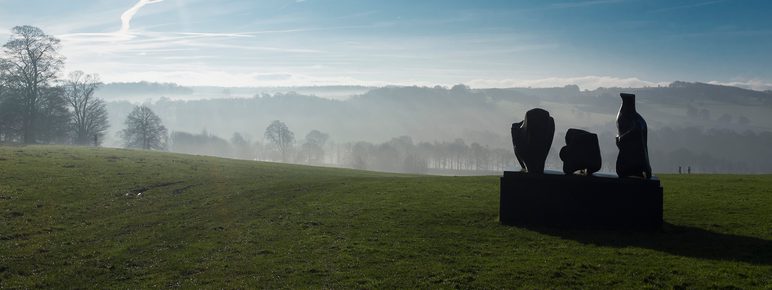 Silhouette of Henry Moore Three Piece Reclining Figure No 1 1961 at Yorkshire Sculpture Park