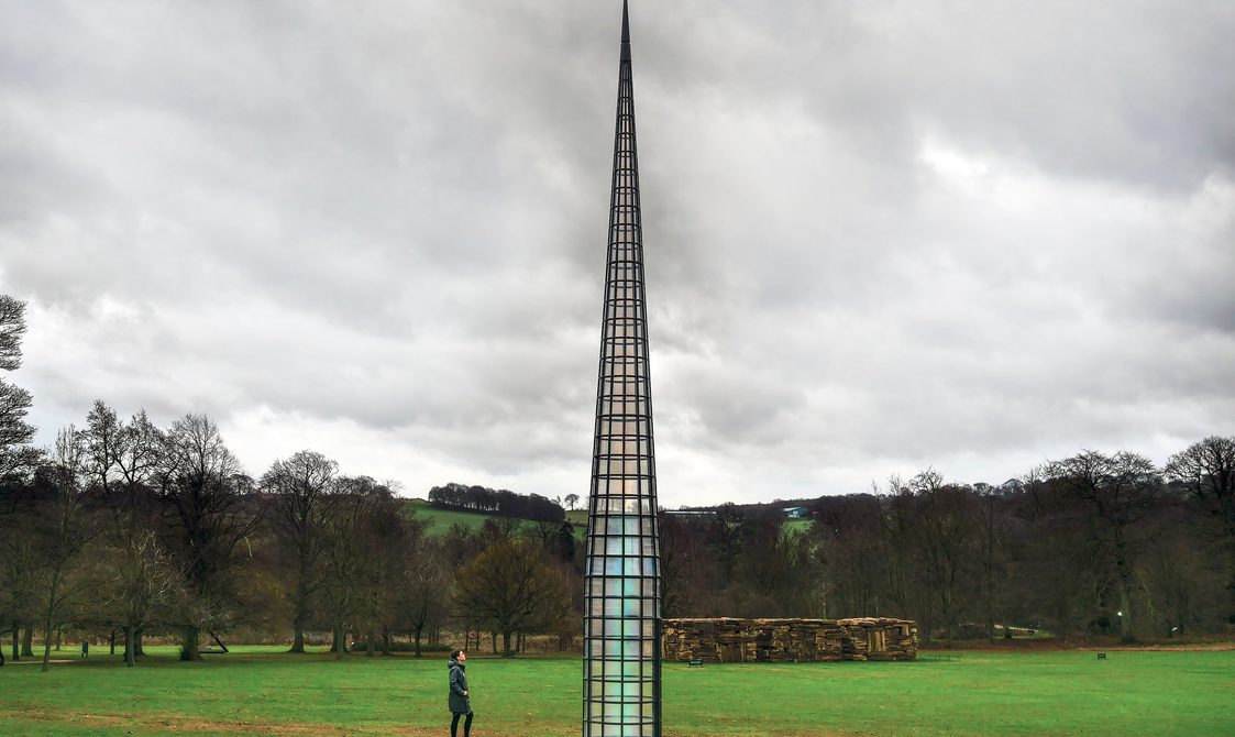 A visitor looking up at Kimsooja – A Needle Woman 2014 at Yorkshire Sculpture Park