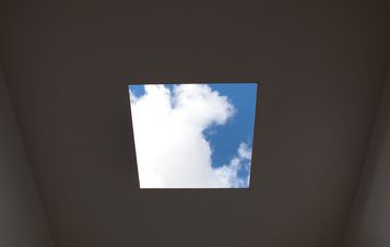 The view through a square hole in the roof of Skyspace, showing a blue sky with clouds.