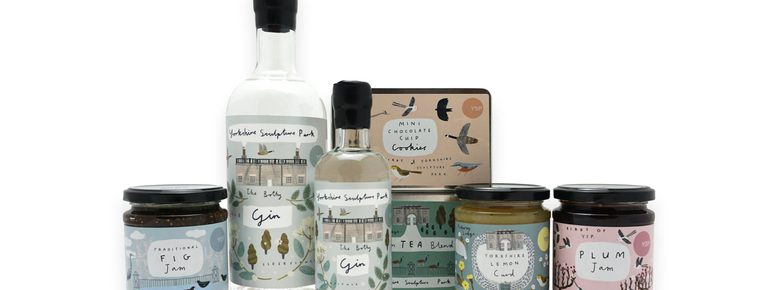 A display of bottles, jars and tins of YSP branded food products, with illustrated labels.