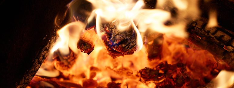 A close up of a burning fire pit