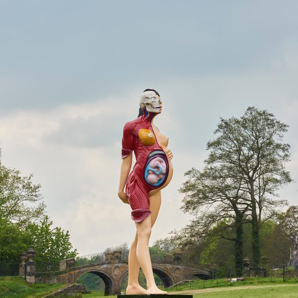Anatomical sculpture of a pregnant woman and fetus in the parkland at YSP.