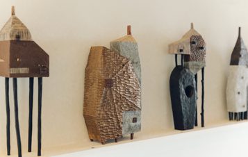 A display of carved wooden houses